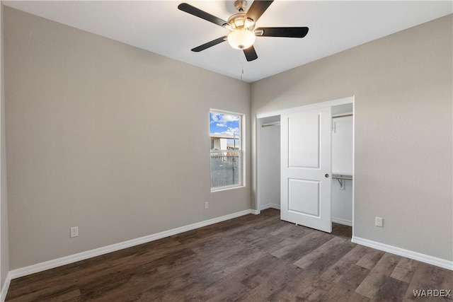 unfurnished bedroom featuring ceiling fan, dark wood-type flooring, a closet, and baseboards