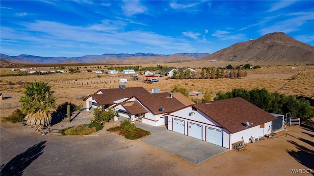 birds eye view of property featuring a mountain view