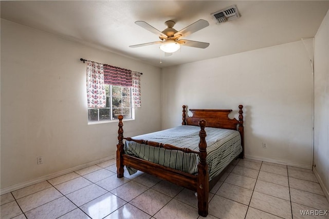 bedroom with ceiling fan, light tile patterned flooring, visible vents, and baseboards