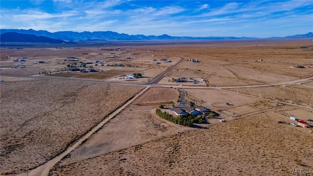 birds eye view of property with a desert view and a mountain view