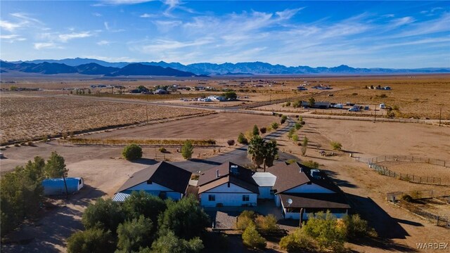 drone / aerial view with a mountain view and a rural view