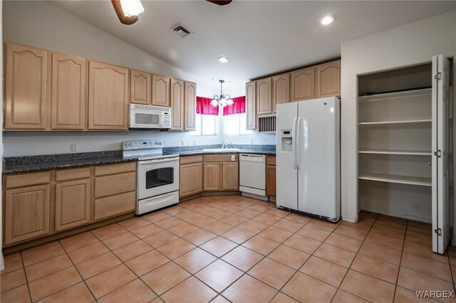 kitchen with light tile patterned floors, white appliances, a sink, visible vents, and hanging light fixtures