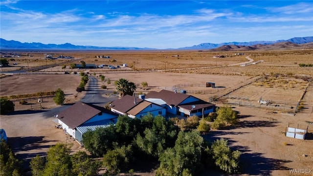 drone / aerial view featuring a mountain view and a rural view