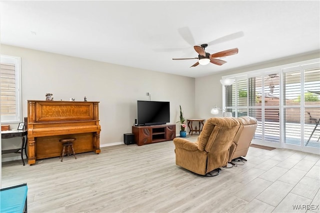 2542 E Alterna Dr, Fort Mohave, AZ 86426 - living room featuring light wood-style flooring and a ceiling fan
