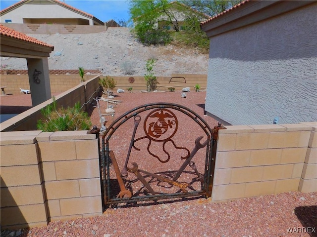 exterior space featuring fence private yard and a gate