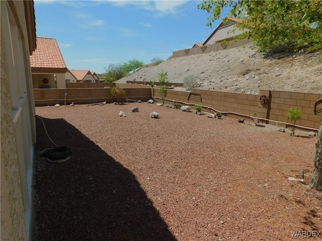 view of yard with a fenced backyard