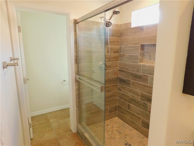 full bathroom featuring tile patterned floors and a stall shower