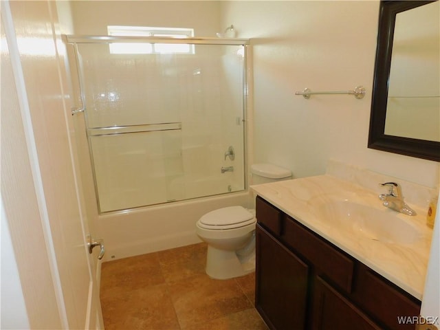 full bathroom with toilet, shower / bath combination with glass door, and vanity