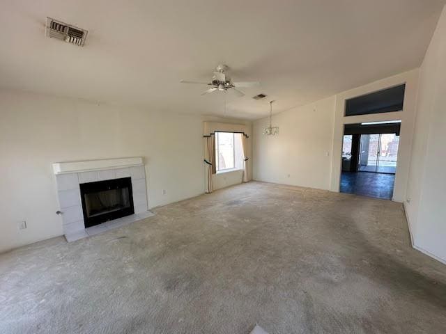2195 Hijolly Dr, Bullhead City, AZ 86442 - unfurnished living room with ceiling fan, a tile fireplace, and carpet flooring