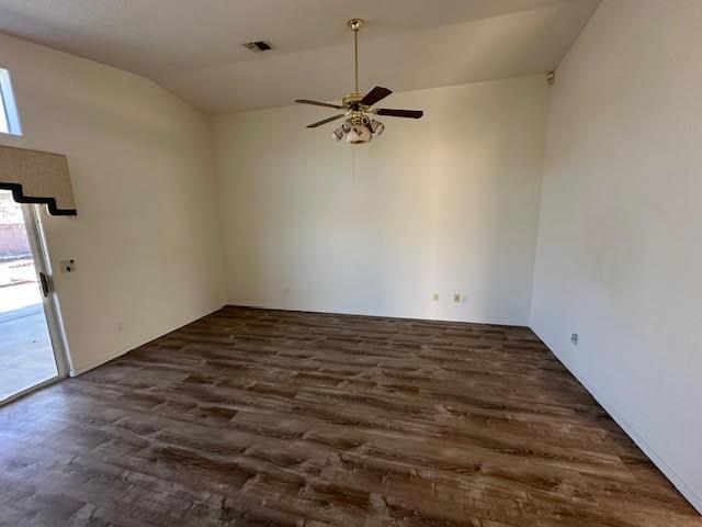 2195 Hijolly Dr, Bullhead City, AZ 86442 - unfurnished room with ceiling fan, dark wood-style floors, and lofted ceiling