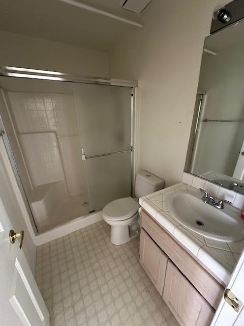 2195 Hijolly Dr, Bullhead City, AZ 86442 - bathroom featuring tile patterned floors, vanity, and a stall shower