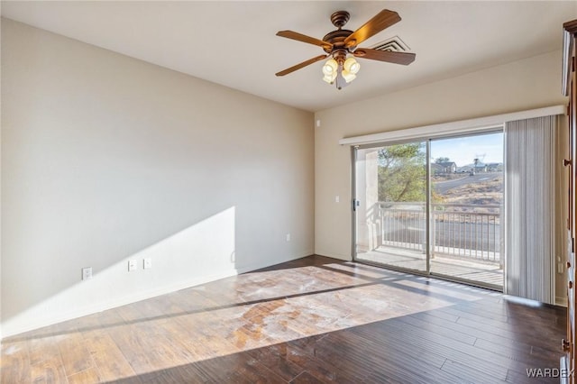 spare room featuring light wood-style floors, ceiling fan, and baseboards