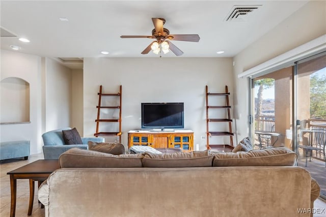 living room with ceiling fan, visible vents, and recessed lighting