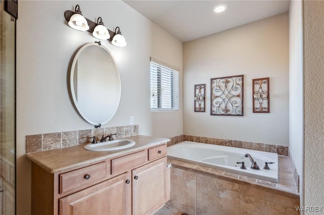 full bath featuring a bath and vanity