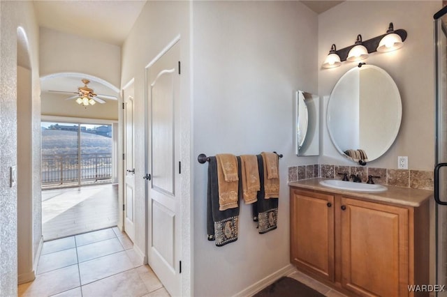 bathroom featuring tile patterned floors, a ceiling fan, and vanity