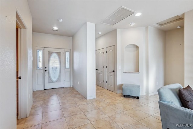 foyer featuring recessed lighting, visible vents, baseboards, and light tile patterned floors