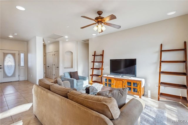 living room featuring recessed lighting, ceiling fan, baseboards, and light tile patterned floors