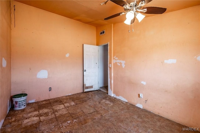 empty room with a ceiling fan and visible vents