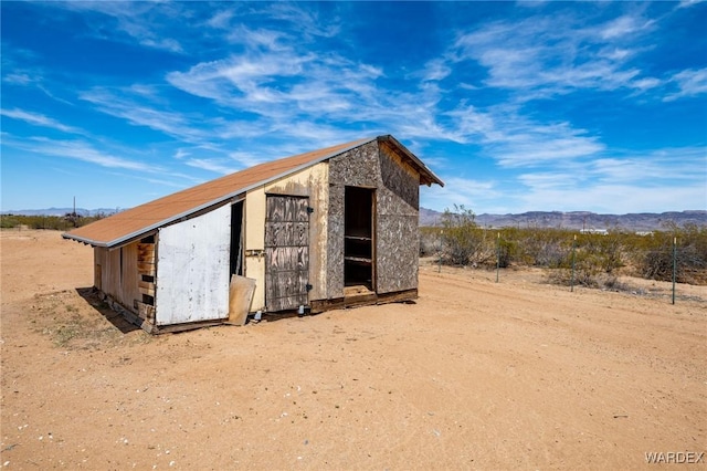 view of outbuilding featuring an outbuilding and a mountain view