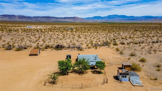 aerial view featuring a rural view, a desert view, and a mountain view