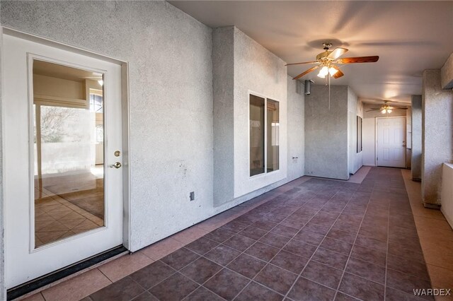 view of patio featuring ceiling fan