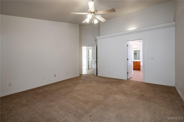 unfurnished room with light carpet, ceiling fan, and baseboards