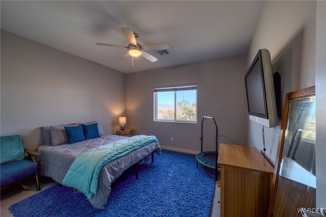 bedroom with visible vents, baseboards, ceiling fan, and carpet flooring