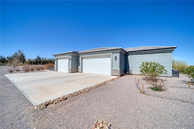 exterior space with concrete driveway