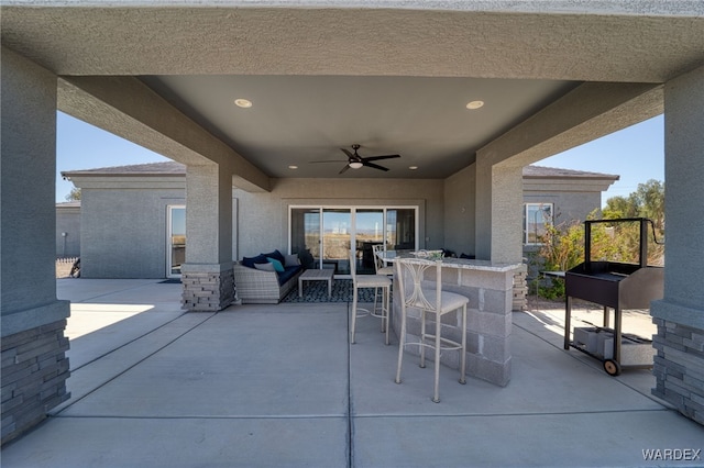 view of patio with an outdoor hangout area and ceiling fan