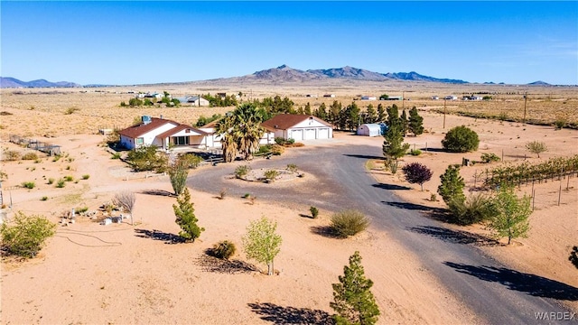 exterior space with a mountain view, a rural view, and view of desert