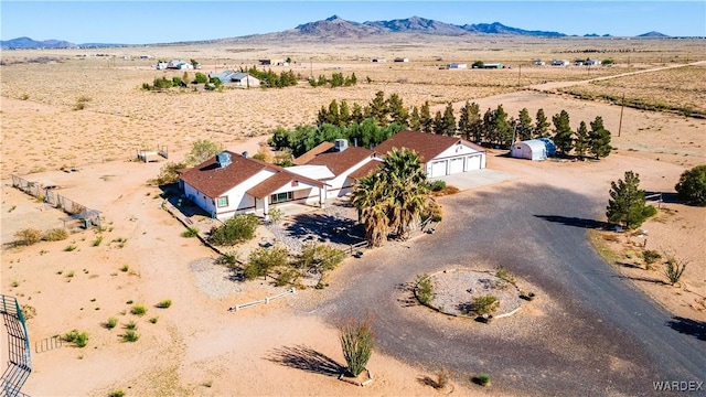 aerial view with a mountain view, a rural view, and view of desert