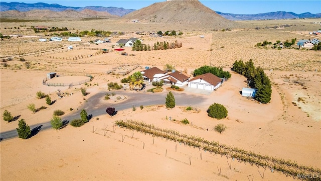 birds eye view of property with a rural view, a desert view, and a mountain view