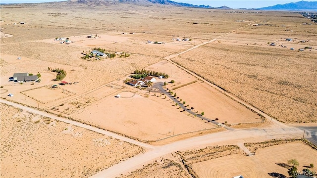 aerial view with a mountain view, a rural view, and view of desert