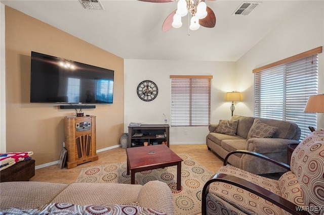 living area with lofted ceiling, visible vents, and plenty of natural light