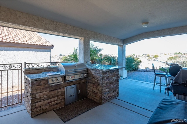 view of patio featuring exterior kitchen and area for grilling