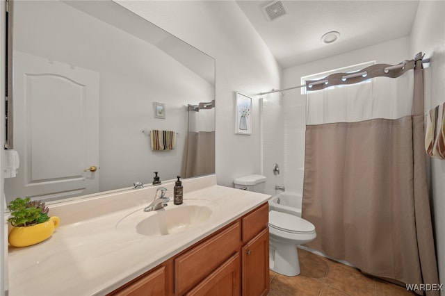 full bath featuring shower / tub combo with curtain, visible vents, toilet, vanity, and tile patterned flooring