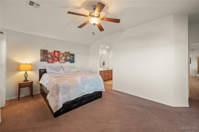 bedroom featuring carpet floors, lofted ceiling, visible vents, and baseboards