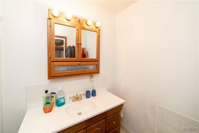 bathroom with backsplash and vanity