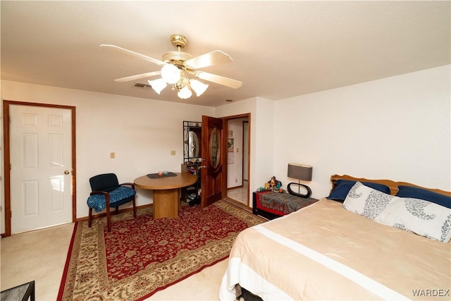 bedroom with ceiling fan, visible vents, and carpet flooring