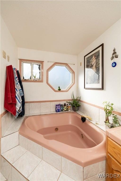 bathroom with a tub with jets