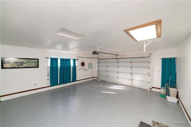 garage featuring baseboards and a garage door opener