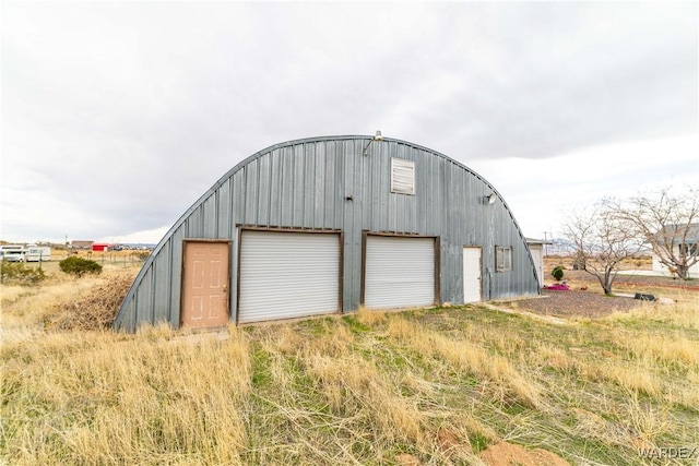 view of outbuilding featuring an outbuilding and driveway