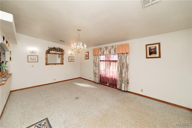 empty room with baseboards, visible vents, a chandelier, and carpet flooring