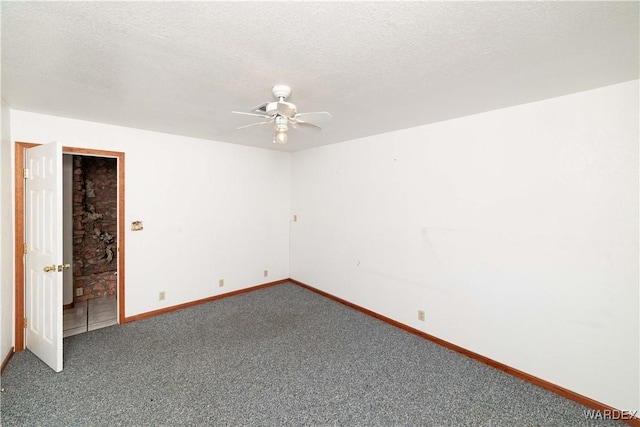 unfurnished room featuring carpet, baseboards, ceiling fan, and a textured ceiling