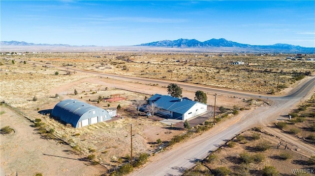 drone / aerial view with a mountain view and a desert view