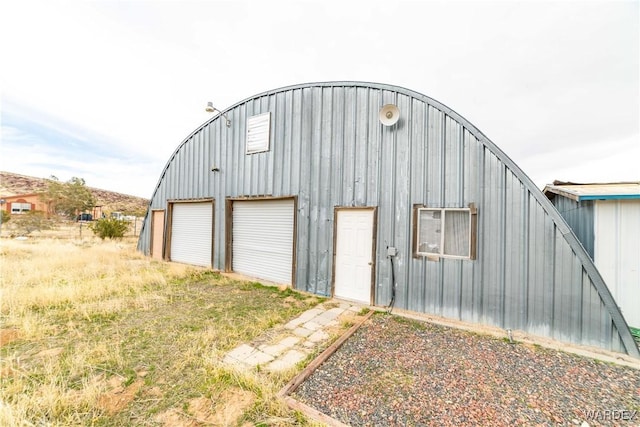 detached garage featuring driveway