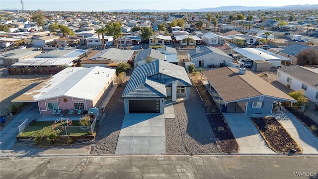 drone / aerial view featuring a residential view and a mountain view