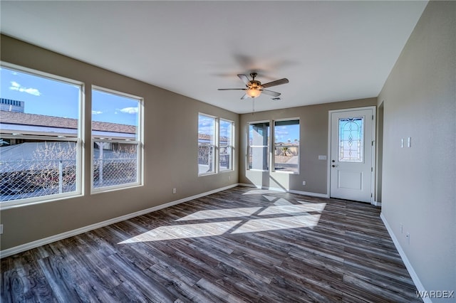 interior space with a wealth of natural light and ceiling fan