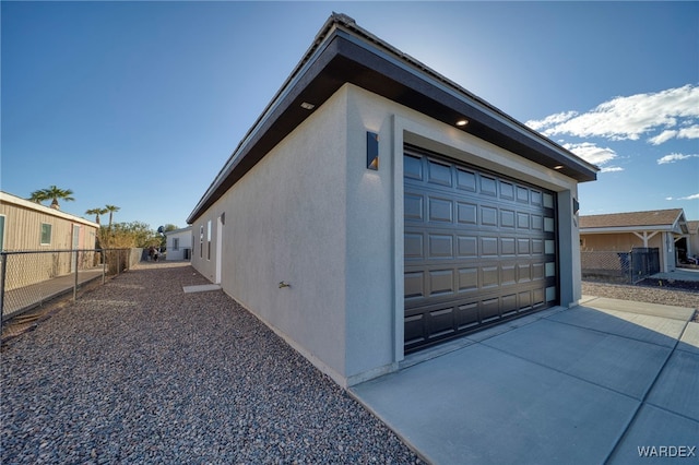 garage featuring fence