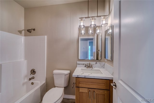 full bathroom with toilet, vanity, and bathing tub / shower combination